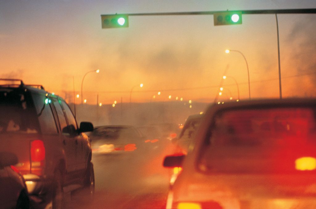 Traffic jam in early evening with exhaust