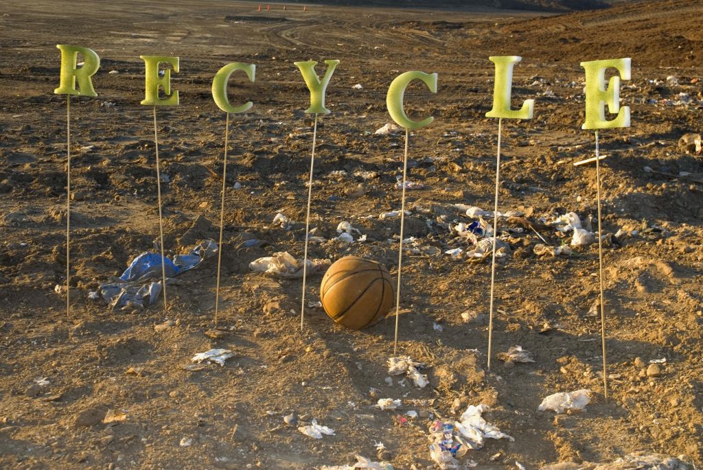 The word 'Recycle' at a city dump.