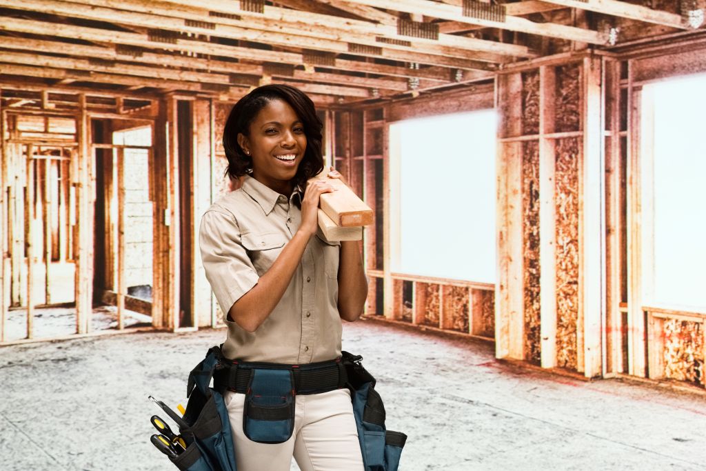 Smiling building contractor in construction site