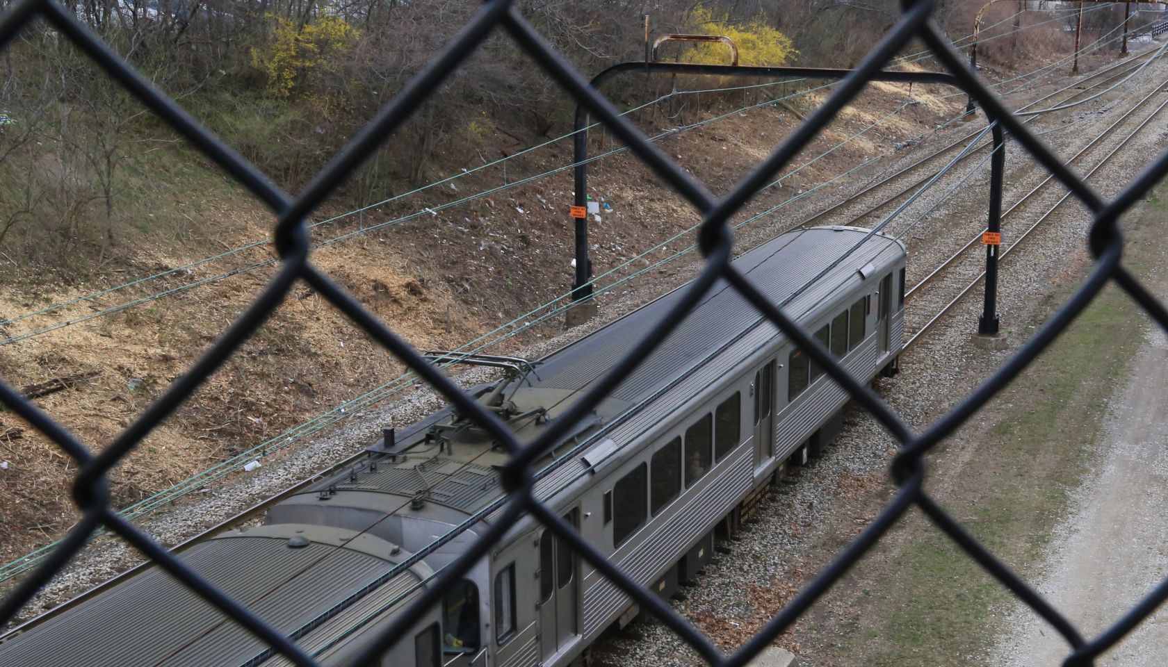 Public transit train seen through overpass , Cleveland, Ohio, USA