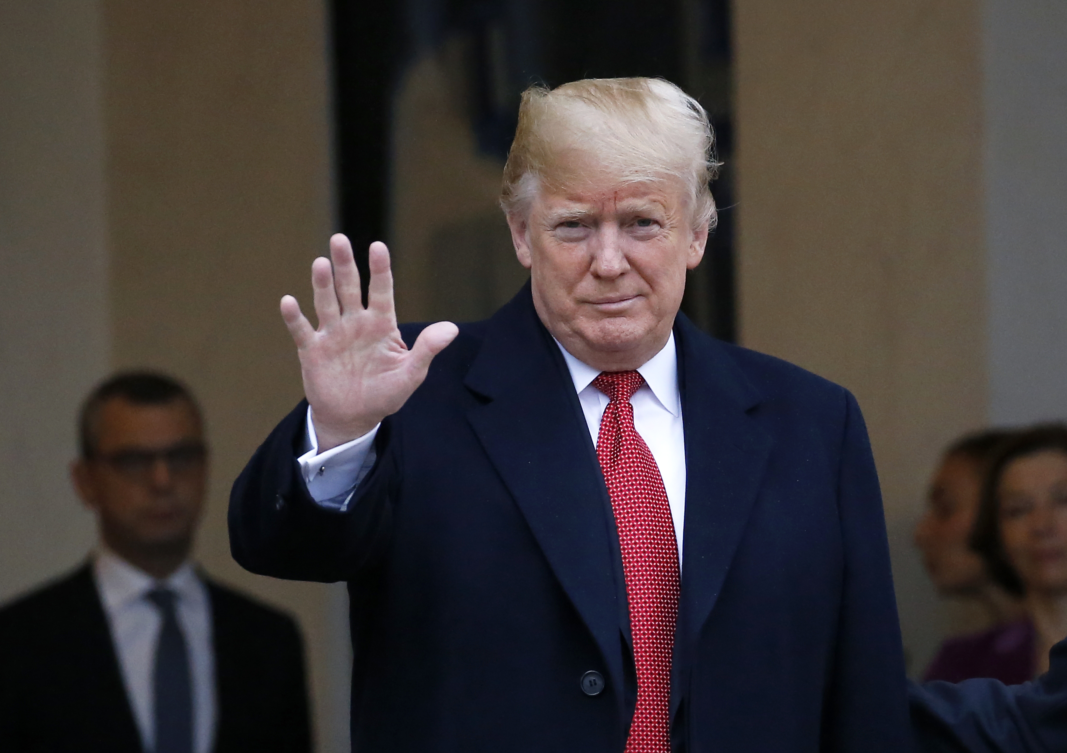 French President Emmanuel Macron welcomes U.S. President Donald Trump at Elysee Palace