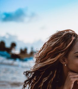 Cute African Couple Lying Down At The Beach