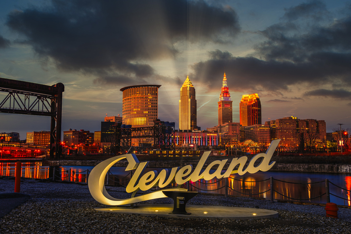Cleveland script sign and city skyline at sunset - Flats West Bank