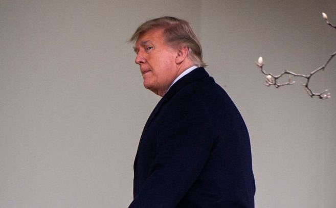 The President and First Lady arrive on the South Lawn of the White House after returning from Florida, on December 31 in Washington, DC.