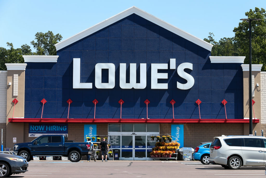 The Lowe's logo is displayed on the front of the store near...