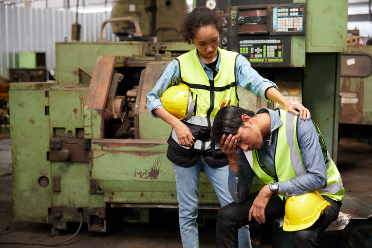 workers or engineer feeling sad after losing a job in the factory